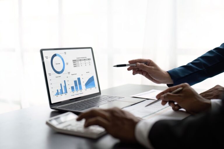 two-male-accountants-use-calculator-to-calculate-t-2023-03-09-21-14-05-utc-2-2048x1365